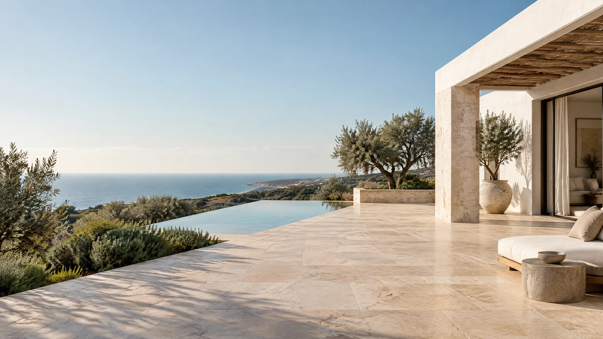 Pale limestone terrace at an Algarve villa overlooking the Atlantic Ocean
